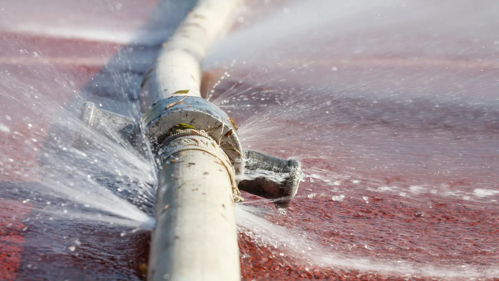 Water spraying from a burst pipe