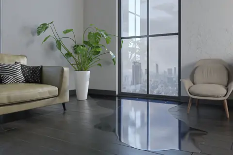 Water spreading across a living room floor