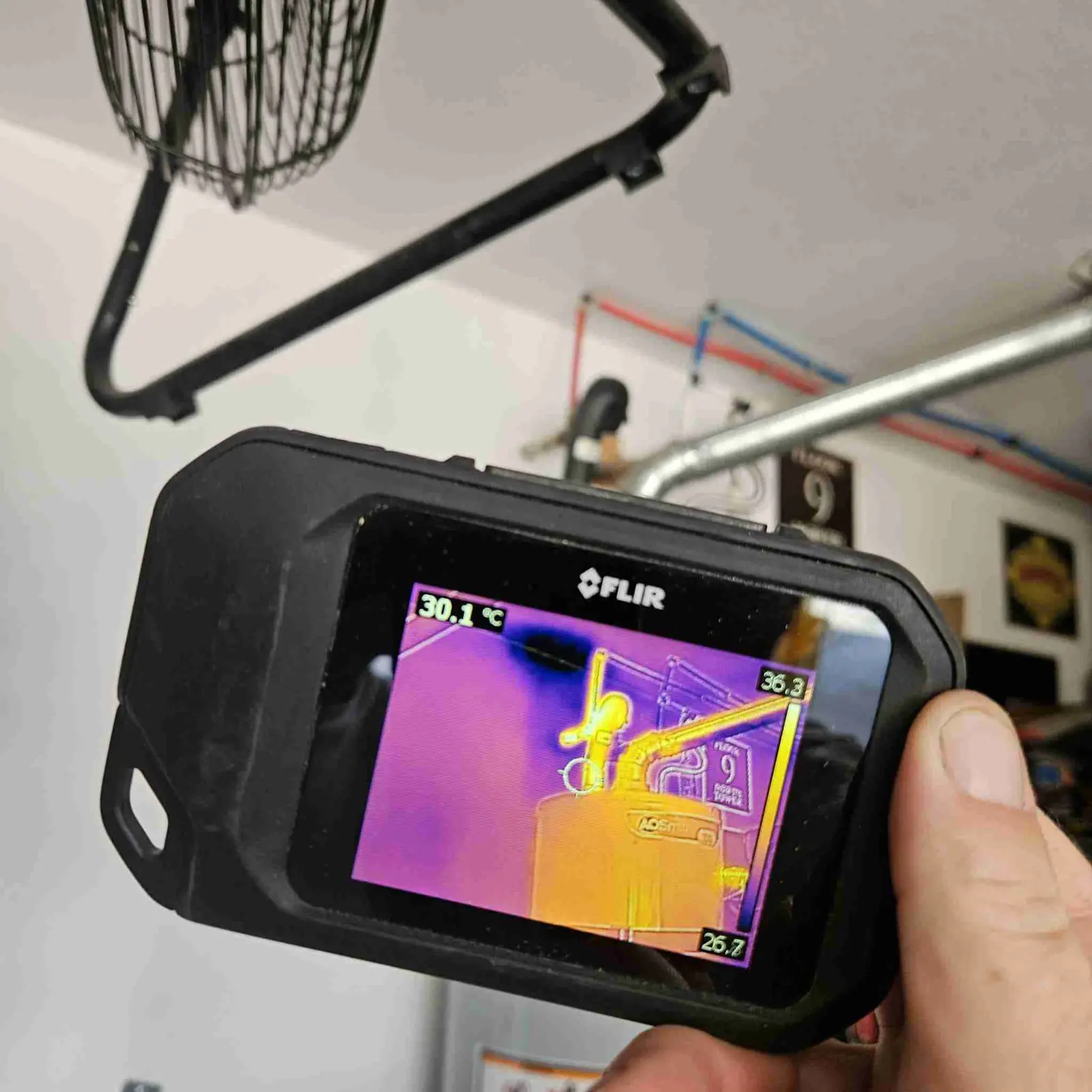 Thermal imaging camera checking water supply lines in a garage