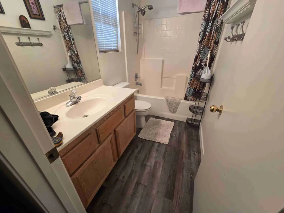 Upstairs bathroom with a hidden leak, before any demolition